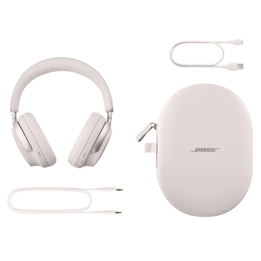 Unos auriculares bluetooth de la marca Bose, modelo Quietcomfort Ultra 11, de color crema junto a sus accesorios (funda y cables de conexión).